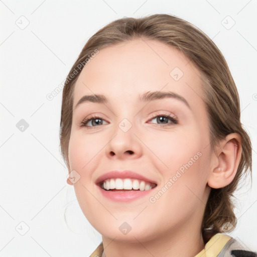 Joyful white young-adult female with medium  brown hair and blue eyes