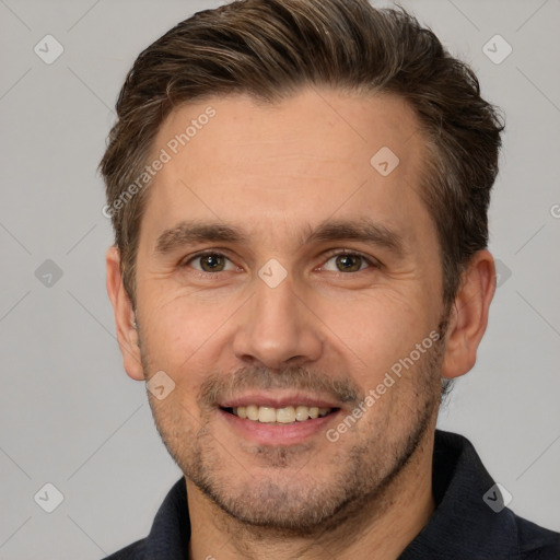 Joyful white adult male with short  brown hair and brown eyes