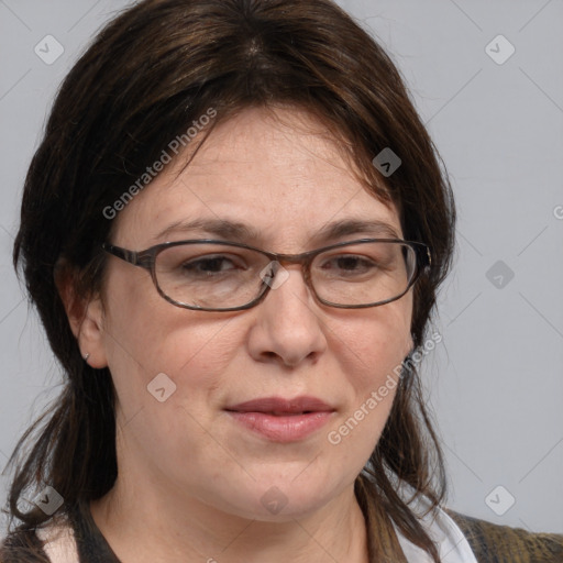 Joyful white adult female with medium  brown hair and blue eyes