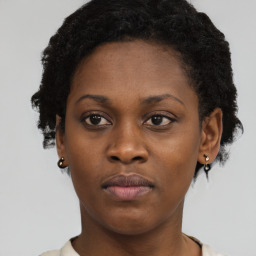 Neutral black young-adult female with short  brown hair and brown eyes