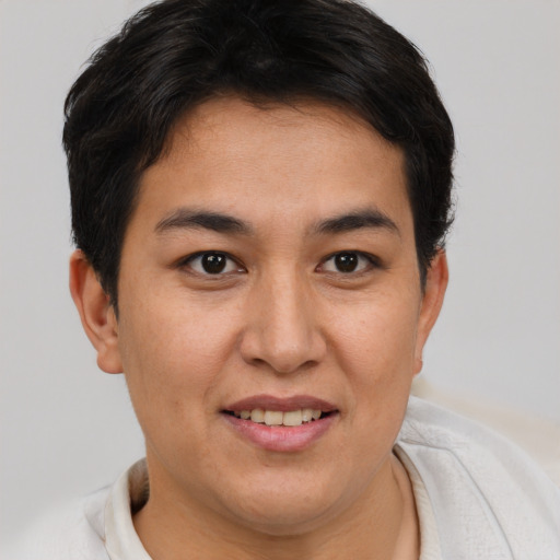 Joyful asian young-adult female with short  brown hair and brown eyes
