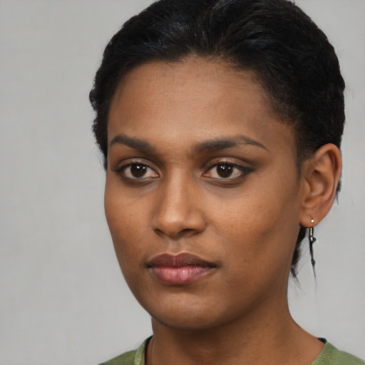 Neutral black young-adult female with short  black hair and brown eyes