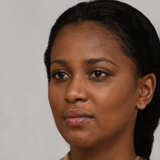 Neutral black young-adult female with medium  black hair and brown eyes