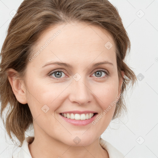 Joyful white young-adult female with medium  brown hair and blue eyes