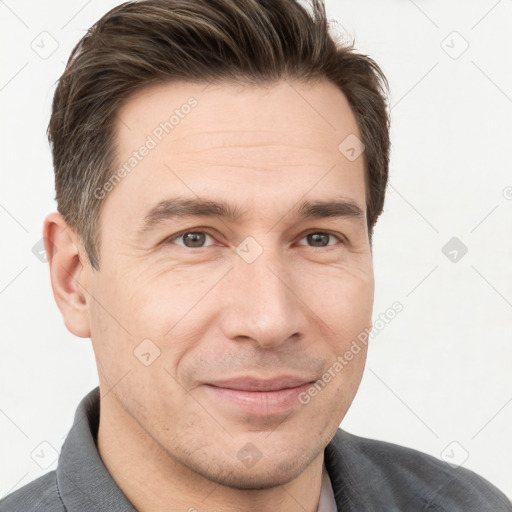 Joyful white adult male with short  brown hair and grey eyes