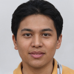 Joyful asian young-adult male with short  black hair and brown eyes