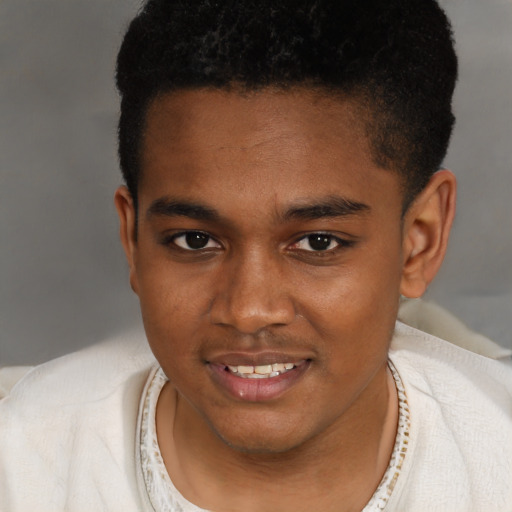Joyful black young-adult male with short  brown hair and brown eyes