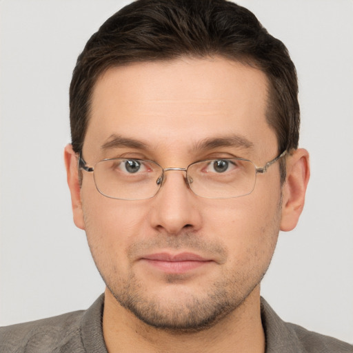 Joyful white adult male with short  brown hair and brown eyes