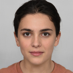 Neutral white young-adult female with medium  brown hair and brown eyes