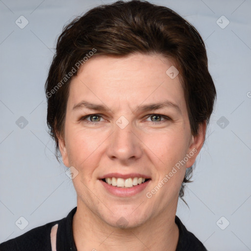 Joyful white adult female with short  brown hair and grey eyes