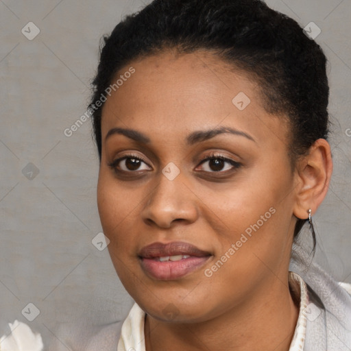 Joyful black young-adult female with short  black hair and brown eyes