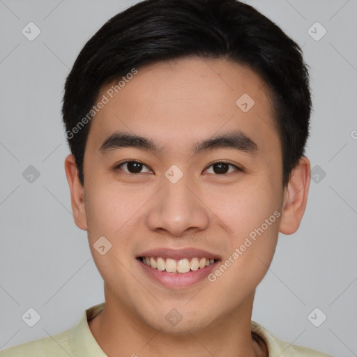 Joyful asian young-adult male with short  brown hair and brown eyes