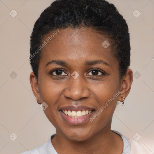 Joyful black young-adult female with short  black hair and brown eyes