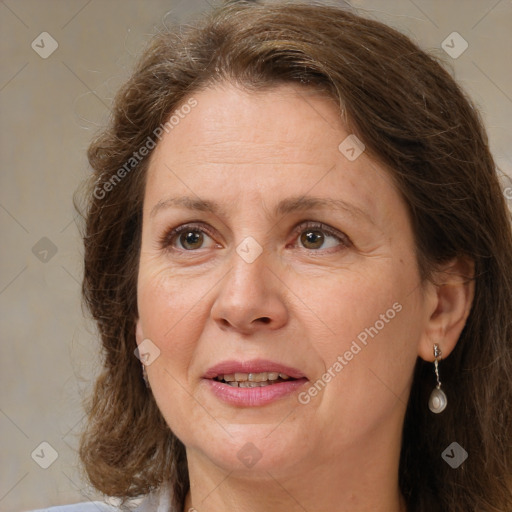 Joyful white adult female with medium  brown hair and brown eyes