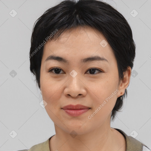 Joyful asian young-adult female with medium  black hair and brown eyes