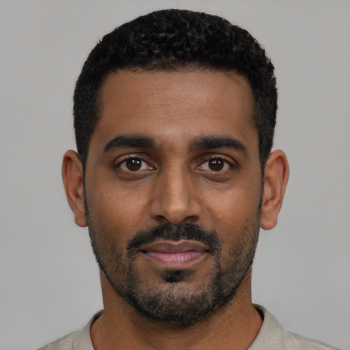 Neutral black young-adult male with short  black hair and brown eyes