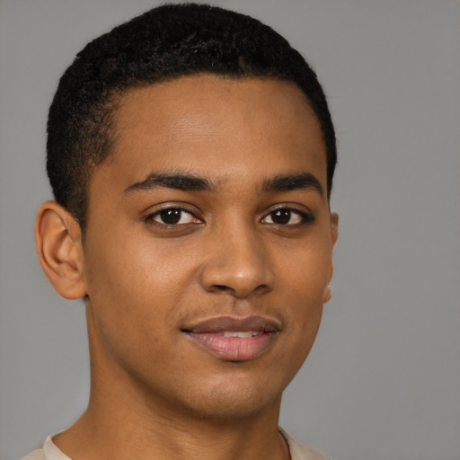 Joyful latino young-adult male with short  brown hair and brown eyes