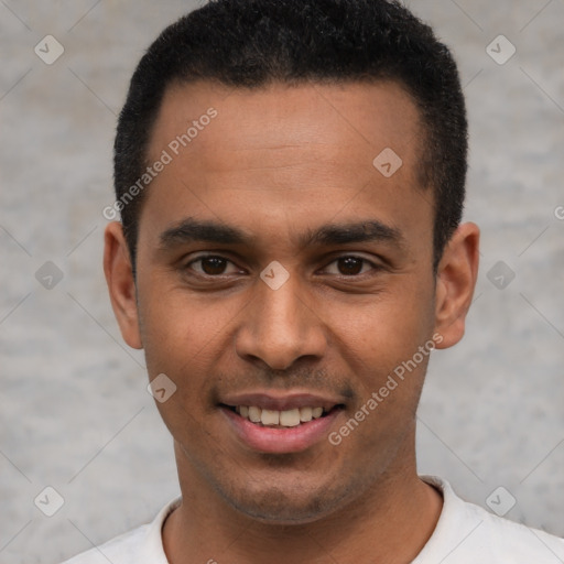 Joyful latino young-adult male with short  black hair and brown eyes