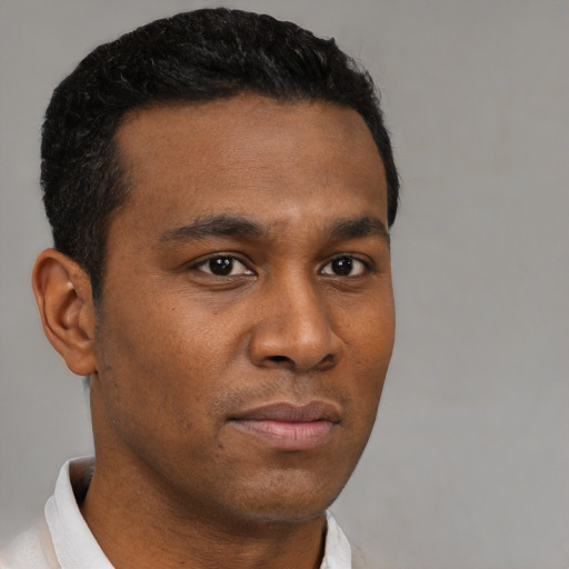 Neutral black young-adult male with short  brown hair and brown eyes