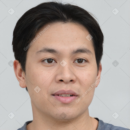 Joyful white young-adult male with short  black hair and brown eyes