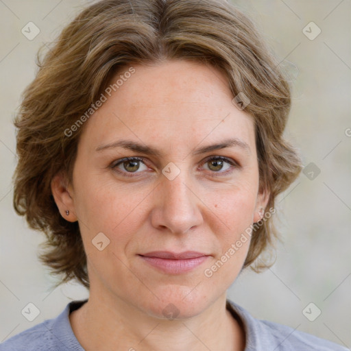 Joyful white adult female with medium  brown hair and blue eyes