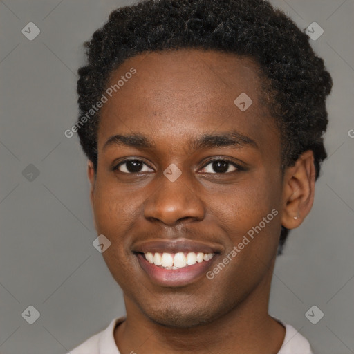 Joyful black young-adult male with short  brown hair and brown eyes