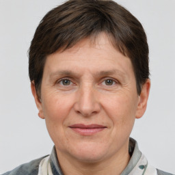 Joyful white adult female with short  brown hair and brown eyes