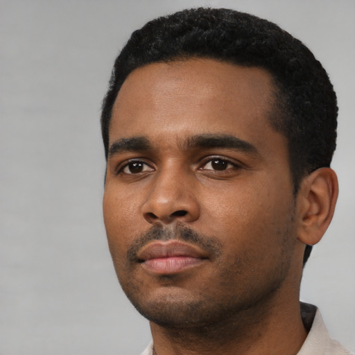 Neutral black young-adult male with short  black hair and brown eyes