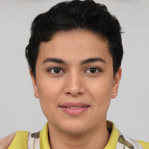 Joyful latino young-adult female with short  brown hair and brown eyes