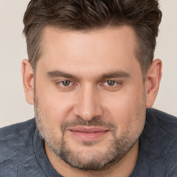 Joyful white adult male with short  brown hair and brown eyes