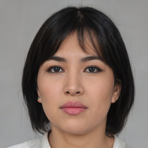 Neutral asian young-adult female with medium  black hair and brown eyes