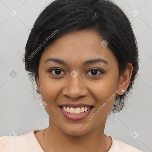 Joyful latino young-adult female with medium  black hair and brown eyes