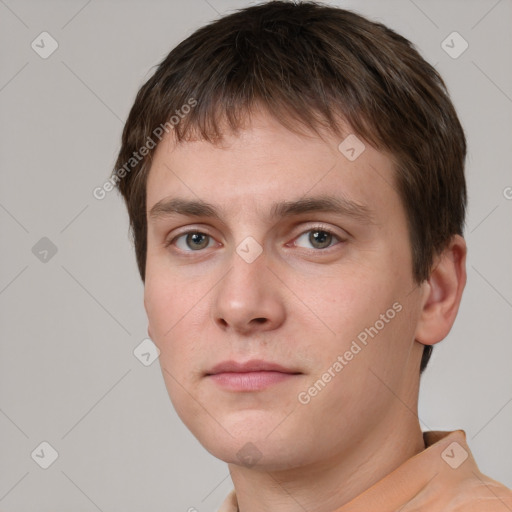 Neutral white young-adult male with short  brown hair and grey eyes