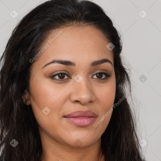 Joyful latino young-adult female with long  brown hair and brown eyes