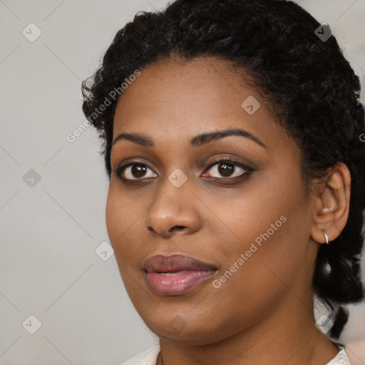 Joyful black young-adult female with medium  black hair and brown eyes