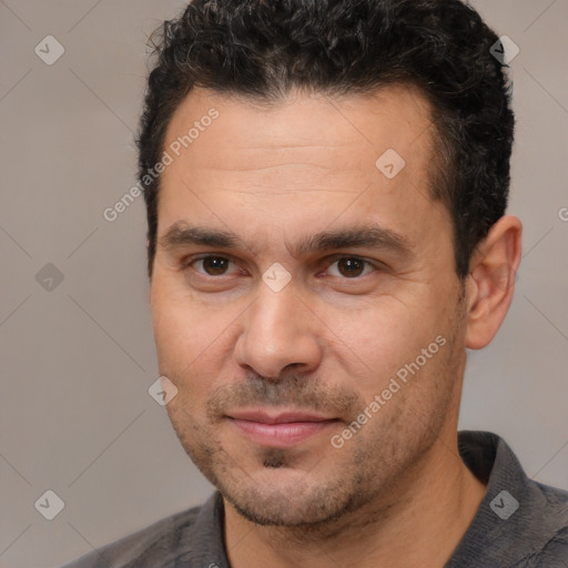 Joyful white adult male with short  brown hair and brown eyes