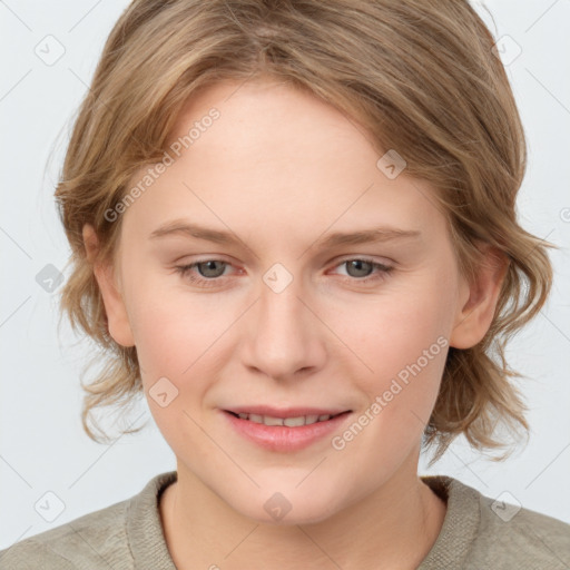 Joyful white young-adult female with medium  brown hair and blue eyes