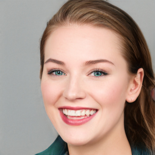 Joyful white young-adult female with long  brown hair and blue eyes