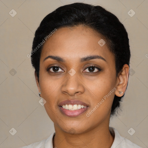 Joyful black young-adult female with short  black hair and brown eyes