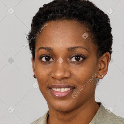 Joyful black young-adult female with short  brown hair and brown eyes