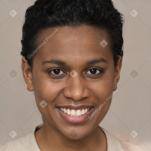 Joyful black young-adult female with short  brown hair and brown eyes