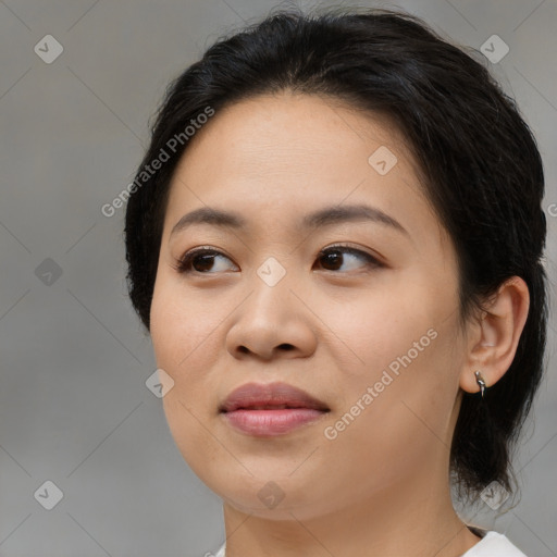 Joyful asian young-adult female with medium  brown hair and brown eyes