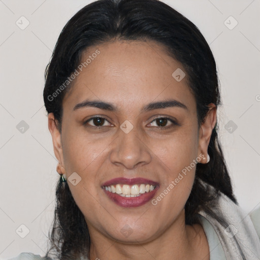 Joyful latino young-adult female with medium  brown hair and brown eyes