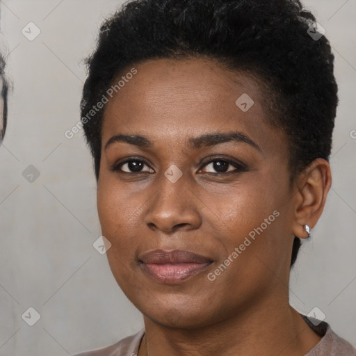 Joyful black young-adult female with short  brown hair and brown eyes