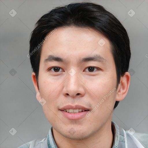 Joyful white young-adult male with short  black hair and brown eyes