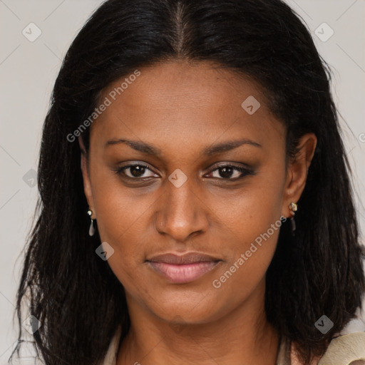 Joyful black young-adult female with long  brown hair and brown eyes