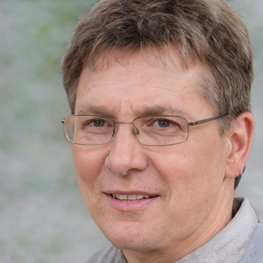 Joyful white middle-aged male with short  brown hair and grey eyes