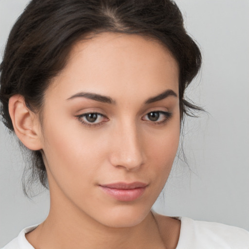 Neutral white young-adult female with medium  brown hair and brown eyes