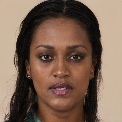 Neutral black young-adult female with long  brown hair and brown eyes