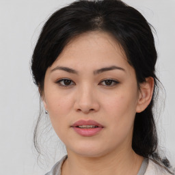 Joyful asian young-adult female with medium  brown hair and brown eyes